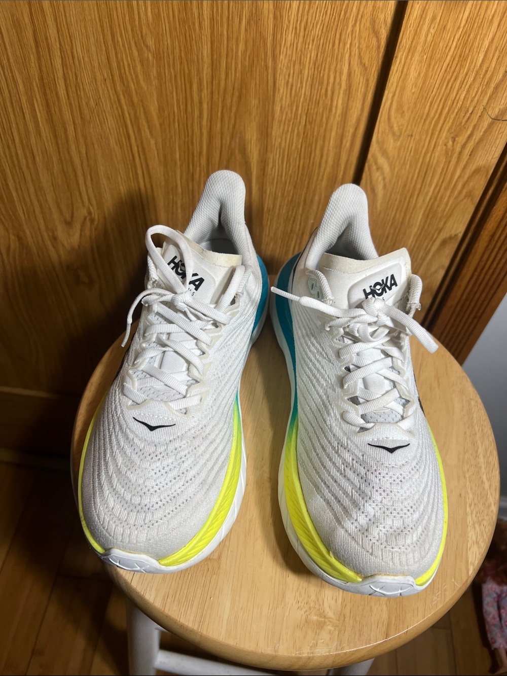 Hoka White Athletic Shoes with Yellow and Teal Accents